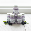 Six Sugared Huckleberry mini mason jars on whitewashed wood